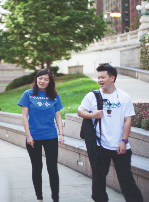 Two students enjoy the outdoors on campus grounds.